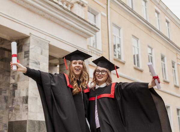 Two female students graduating