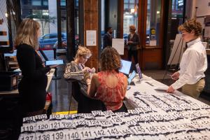 ReWa volunteers checking in attendees at a fundraising event.