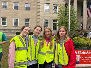 Four high school girls pose for a photo for their Key Club community service