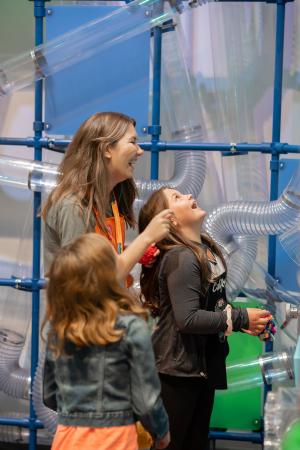 Photo of a museum volunteer with children