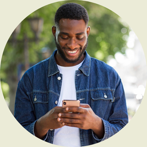 A father on his phone using the Track it Forward mobile app to track volunteer  hours