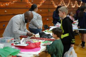 Parents volunteering at a holiday event at Christ the King Catholic School