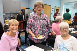 Library volunteers enjoying food at a volunteer appreciation event