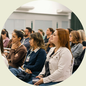 Photo of parents sitting in a presentation at a back to school night orientation