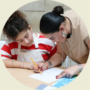 Mother volunteering in class with a student